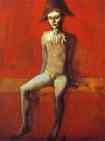 Harlequin Sitting on a Red  Couch.